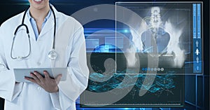 Mid section of female doctor using digital tablet against medical data processing on blue background
