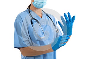 Mid section of female doctor wearing protective gloves against white background