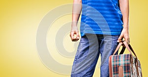 Mid-section of man holding suitcase