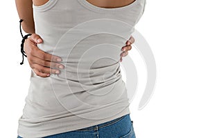 Mid section of woman hugging self