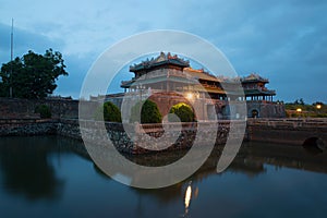 Midday gate of the imperial forbidden city in evening twilight. Hue, Vietnam