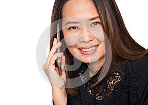 Middle adult Asian woman using smart phone. Smiling and looking