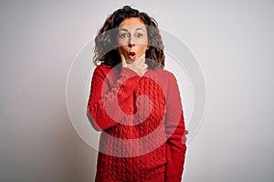 Middle age brunette woman wearing casual sweater standing over isolated white background Looking fascinated with disbelief,