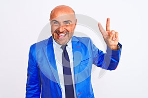 Middle age businessman wearing suit standing over isolated white background showing and pointing up with fingers number two while