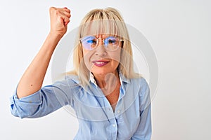 Middle age businesswoman wearing glasses and shirt standing over isolated white background annoyed and frustrated shouting with