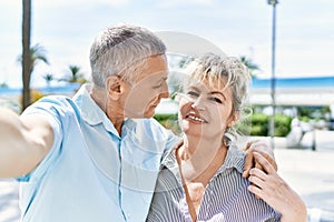 Middle age caucasian couple of husband and wife together on a sunny day outdoors