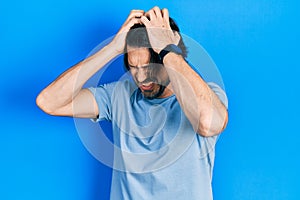 Middle age caucasian man wearing casual clothes suffering from headache desperate and stressed because pain and migraine