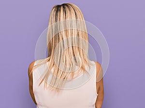 Middle age caucasian woman wearing casual clothes standing backwards looking away with crossed arms