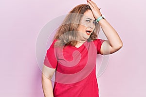 Middle age caucasian woman wearing casual clothes surprised with hand on head for mistake, remember error