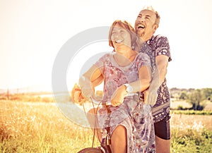 Middle age couple going for a ride with the bicycle