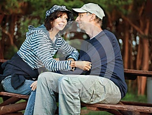 Middle-age couple sitting on a bench