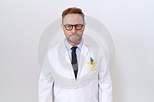 Middle age doctor man with beard wearing white coat skeptic and nervous, frowning upset because of problem