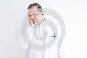 Middle age doctor man wearing medical coat over white background thinking looking tired and bored with depression problems with