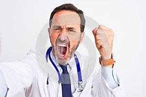 Middle age doctor man wearing stethoscope make selfie over isolated white background annoyed and frustrated shouting with anger,