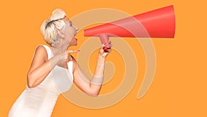 Middle age smiling woman with red megaphone.