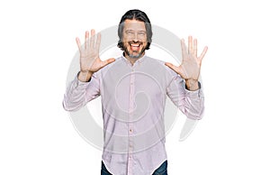 Middle age handsome man wearing business shirt showing and pointing up with fingers number ten while smiling confident and happy