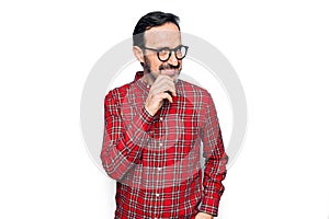 Middle age handsome man wearing casual shirt and glasses over isolated white background smiling looking confident at the camera