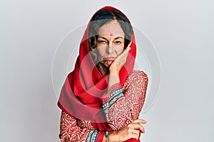 Middle age hispanic woman wearing tradition sherwani saree clothes thinking looking tired and bored with depression problems with