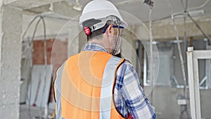 Middle age man builder wearing hardhat at construction site