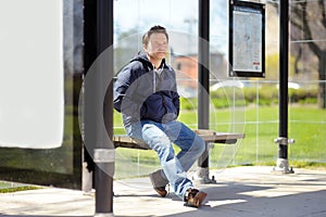 Middle age man on bus stop