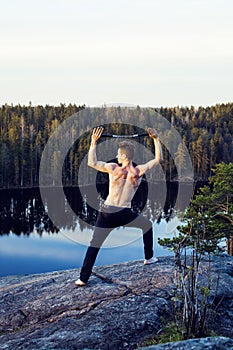 middle age man doing sport yoga on the top of the mountain, lifestyle people outdoor, summer wild nature for training