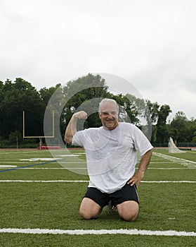Middle age man exercising sports field