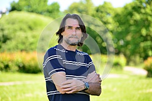 Middle Age Man Standing Outdoors