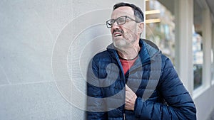 Middle age man suffering heart attack at street