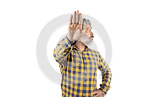 Middle age man wearing casual clothes makes a stop gesture with sad and afraid expression. shameful and negative concept