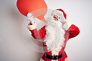 Middle age man wearing Santa costume holding speech bubble over isolated white background with happy face smiling doing ok sign