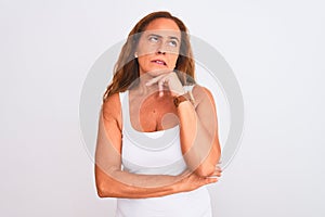 Middle age mature woman standing over white isolated background Thinking worried about a question, concerned and nervous with hand