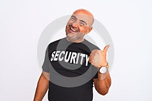 Middle age safeguard man wearing security uniform standing over isolated white background doing happy thumbs up gesture with hand