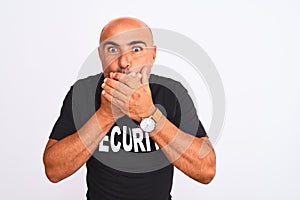 Middle age safeguard man wearing security uniform standing over isolated white background shocked covering mouth with hands for