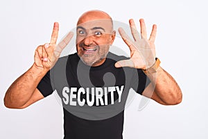 Middle age safeguard man wearing security uniform standing over isolated white background showing and pointing up with fingers