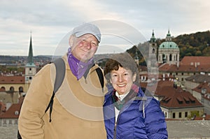 middle age senior smiling man woman tourist couple Castle District Prague Czech Republic