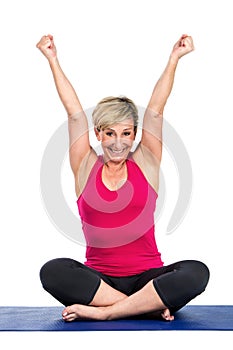 Middle age woman with arms raised