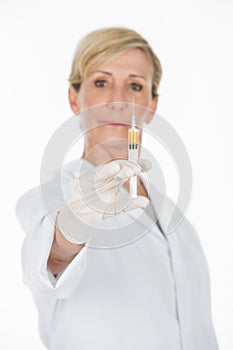 Middle age woman doctor with syringe
