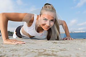 Middle age woman doing push ups