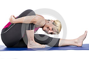 Middle age woman doing yoga exercises