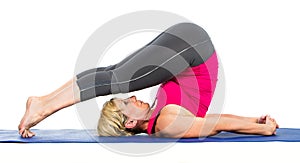 Middle age woman doing yoga exercises