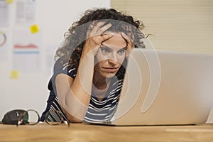 Exausted woman at the office photo