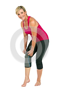 Middle age woman with patellar knee brace photo