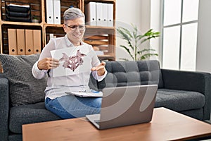 Middle age woman psychologist having online rorscharch test at pyschology center