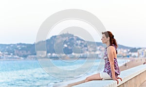 Middle age woman on a quay