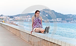 Middle age woman on a quay