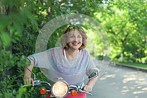 Middle age woman riding motor scooter