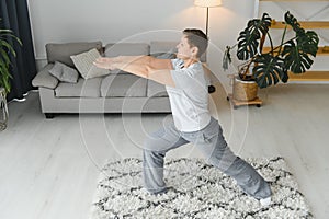 Middle age woman smiling happy doing exercise and stretching at home