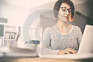 Middle age woman using computer