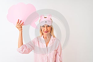 Middle age woman wearing sleep mask holding speech bubble over isolated white background with a confident expression on smart face