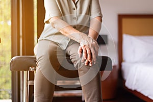 Middle aged adult woman suffering from arthritis disease,Women touching on knee,Osteoarthritis